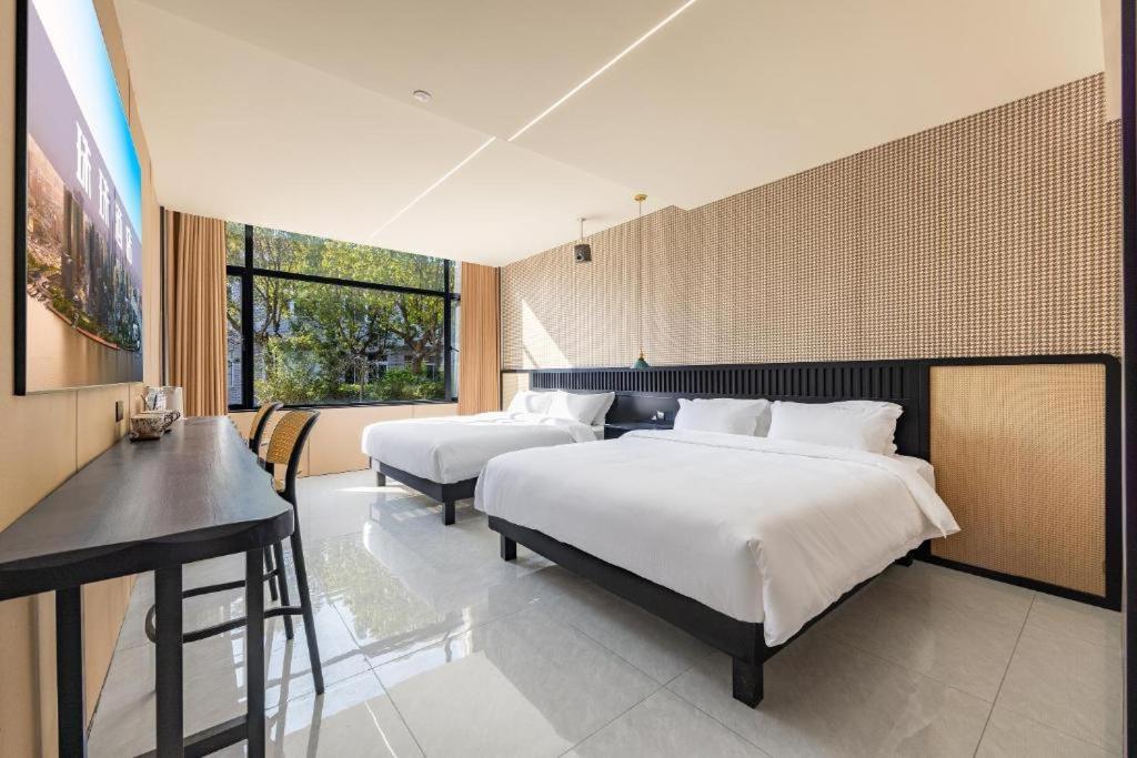 Ένα ή περισσότερα κρεβάτια σε δωμάτιο στο Platinum Selection Hotel 7x24Airport pick-up and drop-off