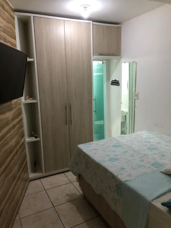 Ένα ή περισσότερα κρεβάτια σε δωμάτιο στο Kitnet Aconchego Morro de São Paulo