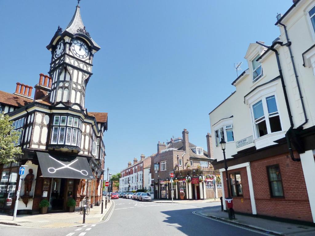 a town with a clock tower on a street at Courtside Apartment Southsea in Portsmouth