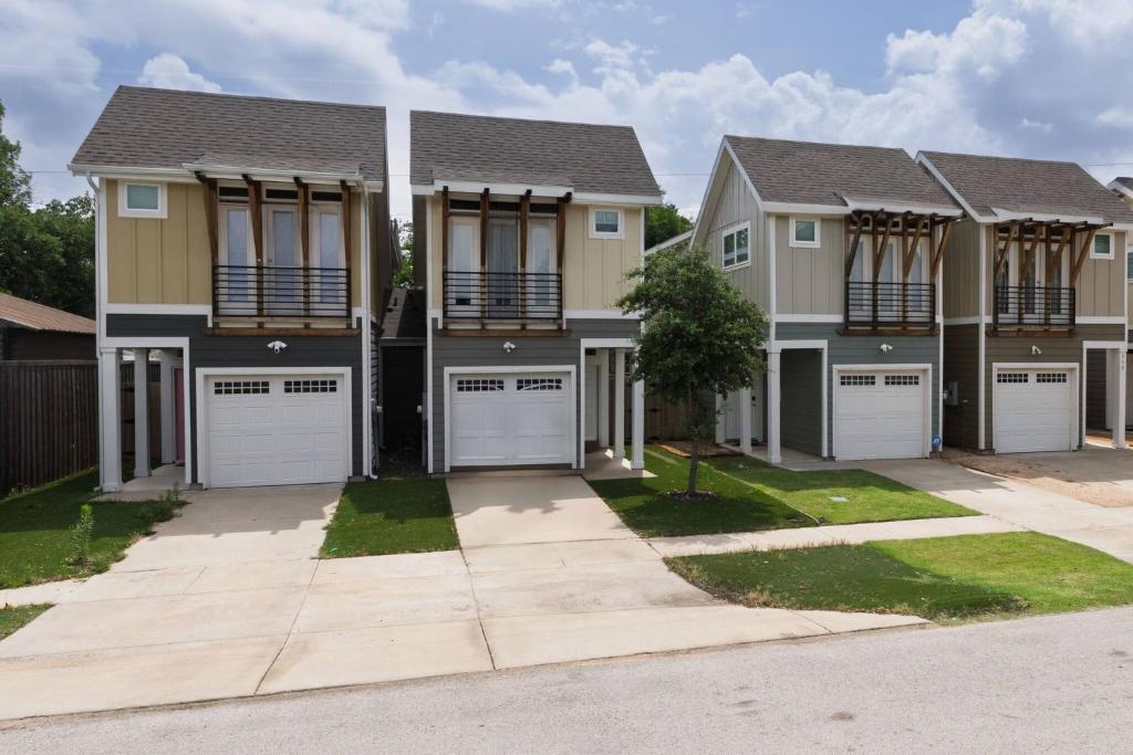 a large house with four garages at Fenced Backyard - Walk to Old Town Lewisville in Lewisville