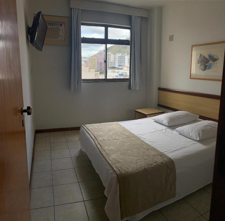 Ένα ή περισσότερα κρεβάτια σε δωμάτιο στο Solar Flat Hotel