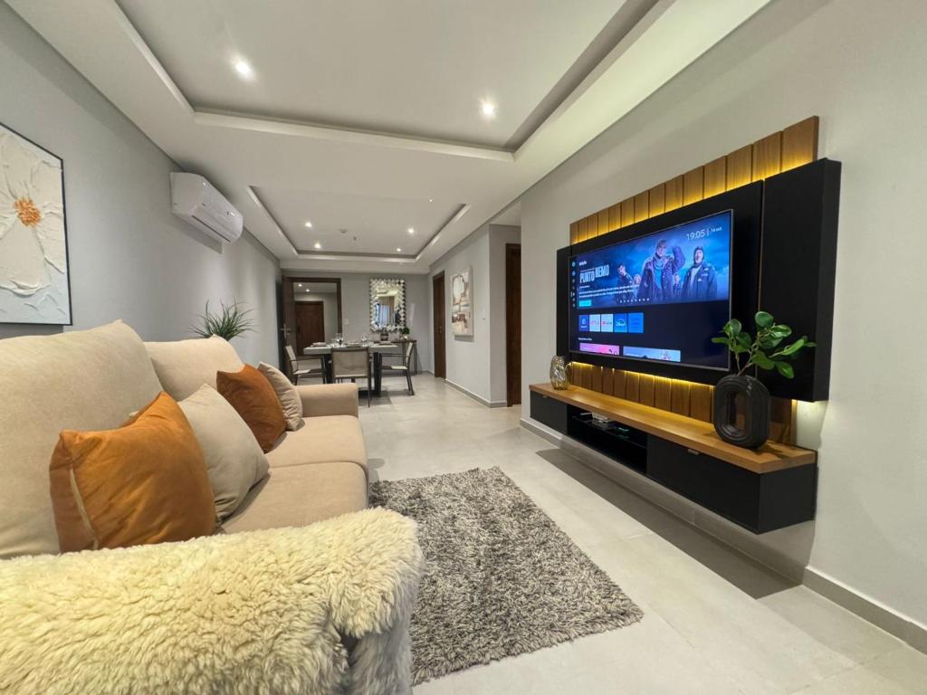 A television and/or entertainment centre at Modern 2 Br Apt In Las Lomas Close To Shop Del Sol