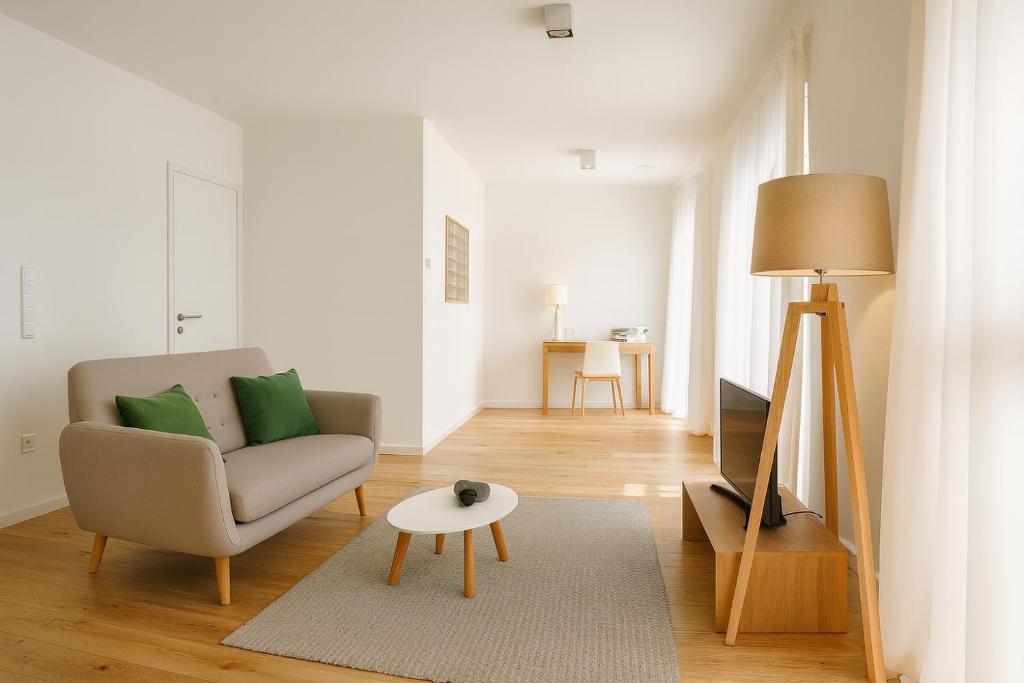 a living room with a couch and a table at Adorable Apartment City Center with Parking, Near Tram in Luxembourg