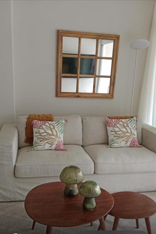a living room with a couch and a table at Hola La Fuente in Puerto de Mogán
