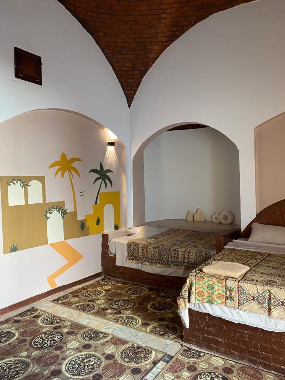 Postel nebo postele na pokoji v ubytování Bahariya Oasis hotel