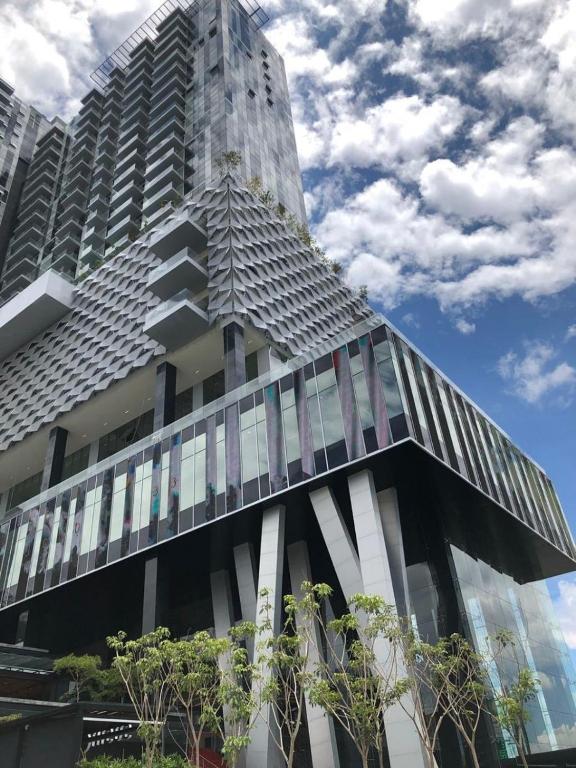 a building in front of a tall building at Departamento Lobby 33 in Guadalajara