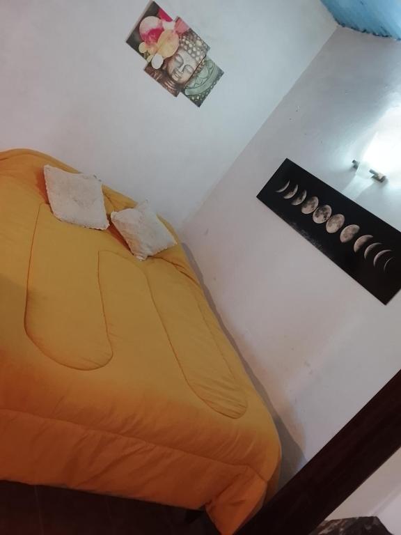 a bed with two pillows on top of a table at Alojamiento nerea in Salto