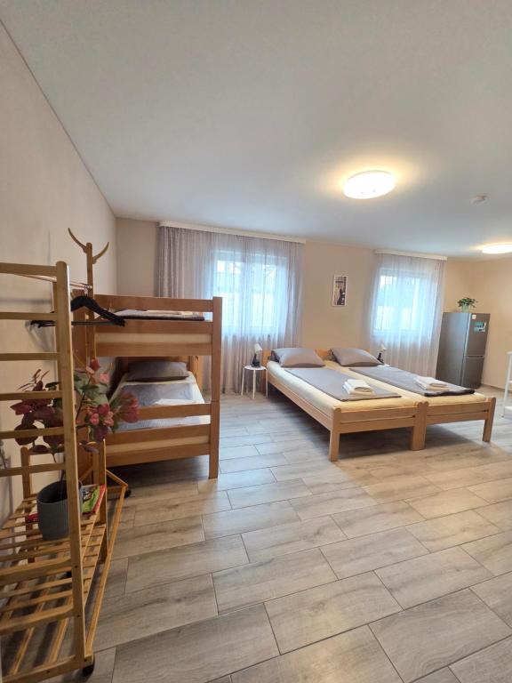 Ένα ή περισσότερα κρεβάτια σε δωμάτιο στο Prime Apartment Hotel