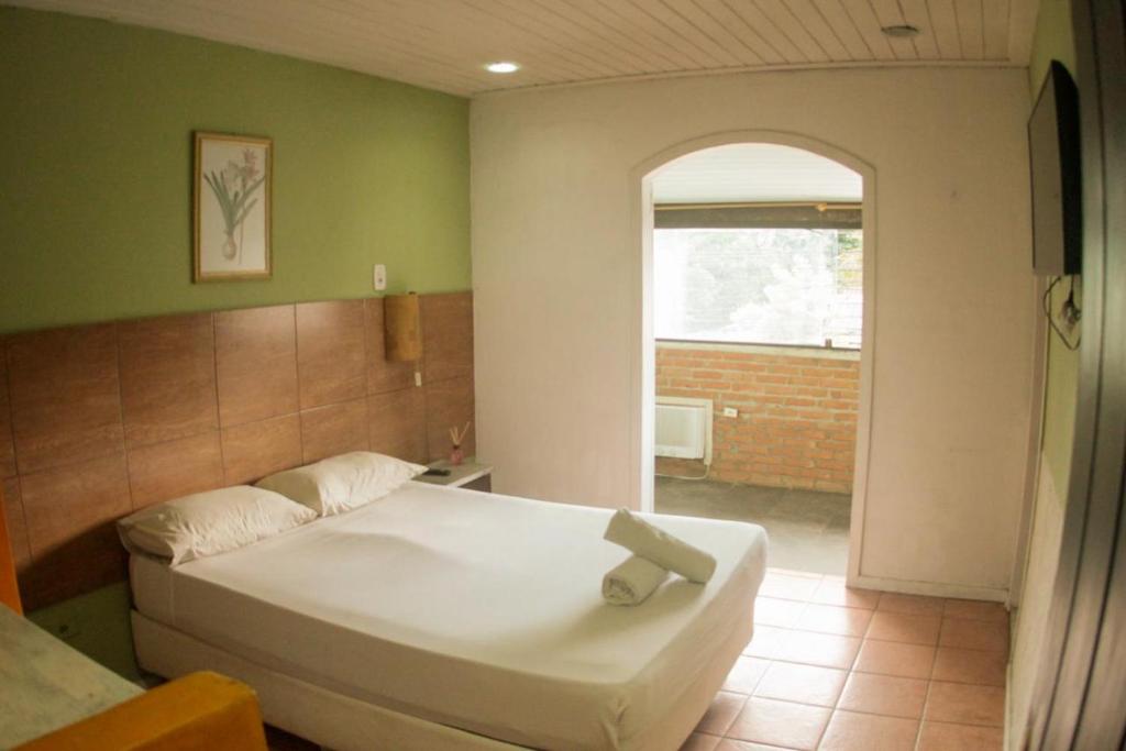 Una cama o camas en una habitación de Pousada Casa Maré