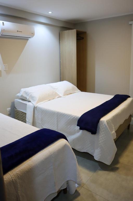 Ένα ή περισσότερα κρεβάτια σε δωμάτιο στο Catamarã Pé na Areia