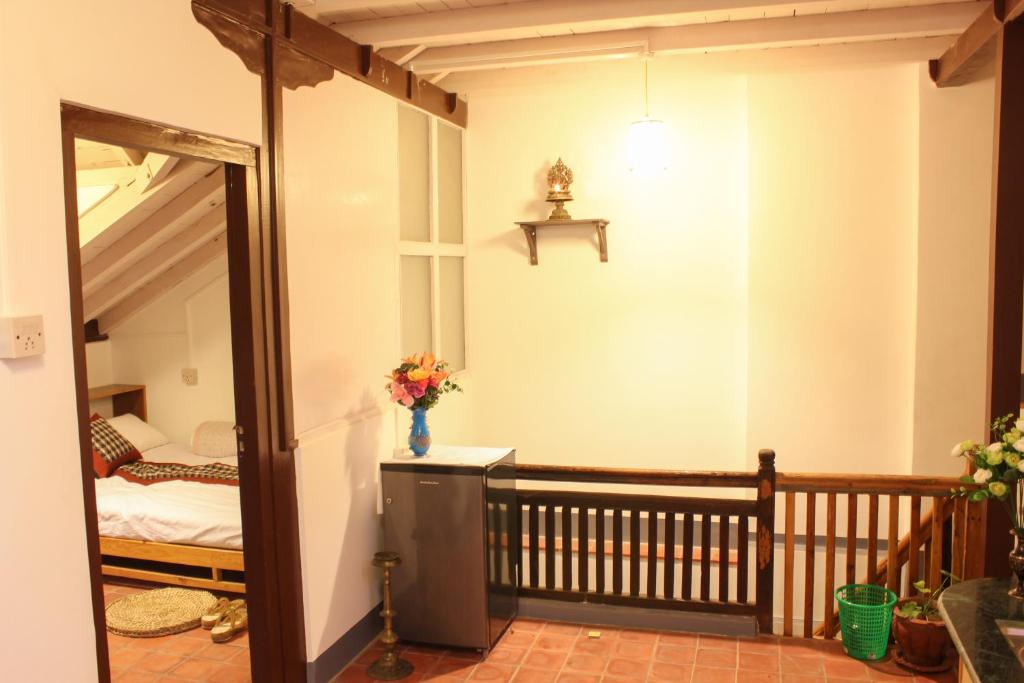 Postel nebo postele na pokoji v ubytování Hiranya Guest House