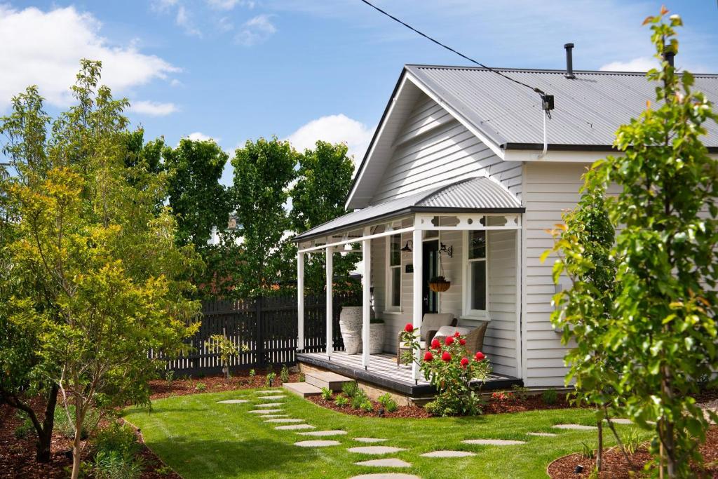 a white house with a gazebo at Wayward Cottage in Daylesford