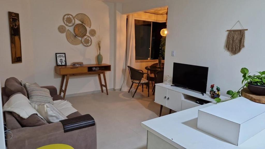 Et tv og/eller underholdning på Apartamento Tranquilidade de Vilas do Atlântico