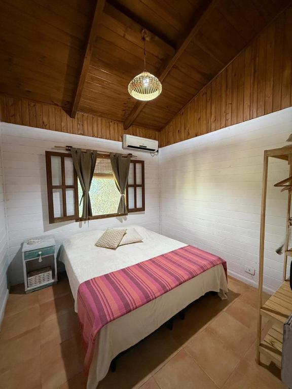 a bedroom with a large bed in a room at Casa Nani in Ituzaingó