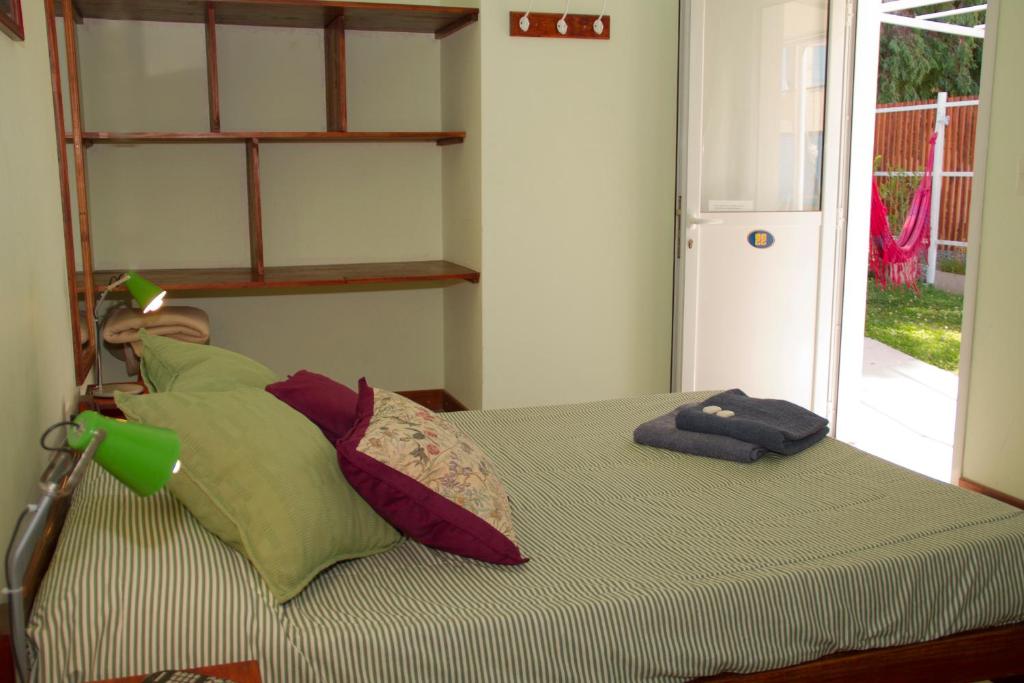 Postel nebo postele na pokoji v ubytování La Tosca Hostel
