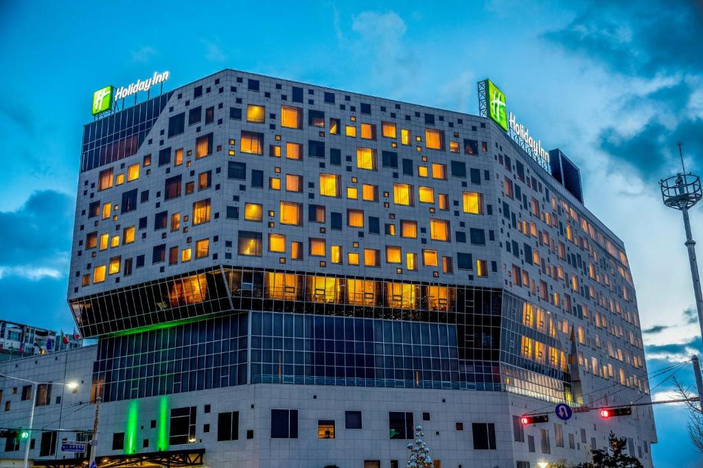 a tall building with windows on the side of it at Holiday Inn Gwangju by IHG in Gwangju
