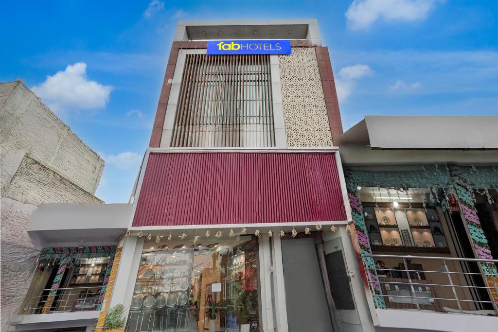 a store front with a sign on top of it at FabHotel Citi Residenci in Varanasi