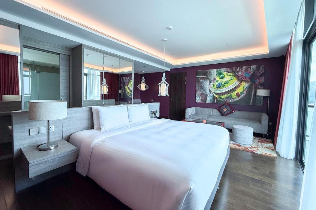 Ένα ή περισσότερα κρεβάτια σε δωμάτιο στο Angsana Teluk Bahang, Penang