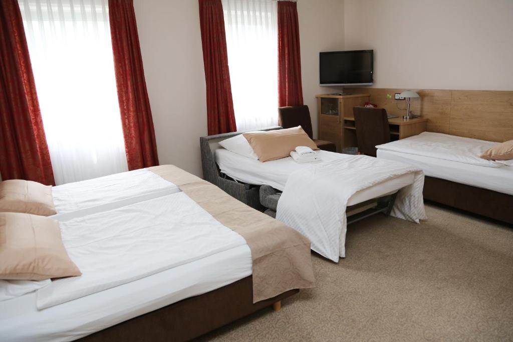 Postel nebo postele na pokoji v ubytování Hotel Lindleinsmühle