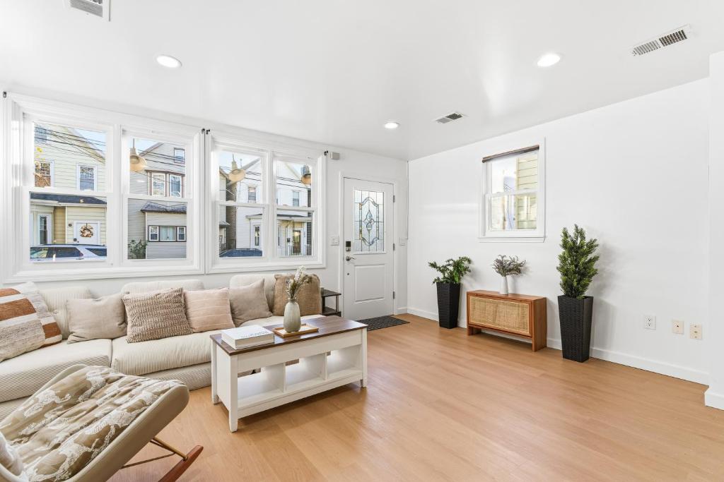 a living room with a couch and a table at Hamilton in Harrison