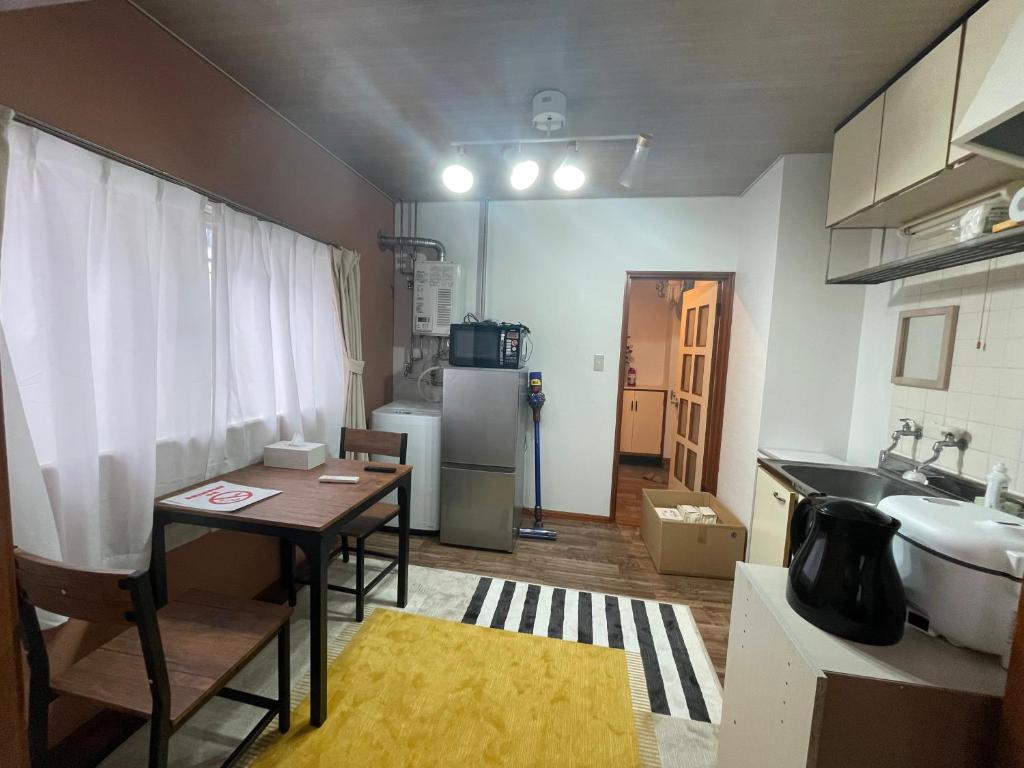 Η κουζίνα ή μικρή κουζίνα στο サイプレス平岸