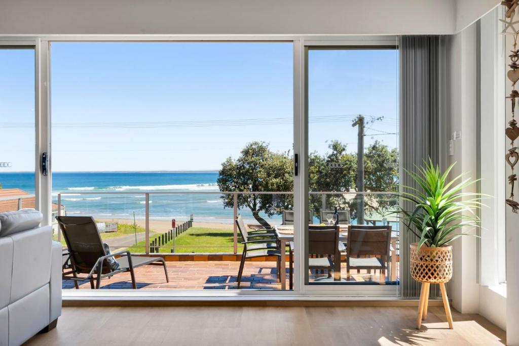 a living room with a view of the ocean at The Rotunda, Gerroa in Gerroa