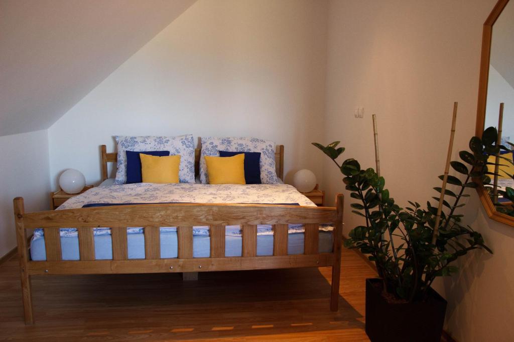 A bed or beds in a room at Penzion Conti