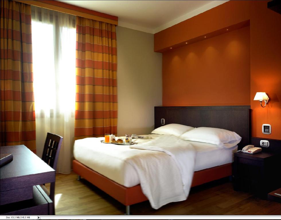 Postel nebo postele na pokoji v ubytování Hotel Dei Vicari
