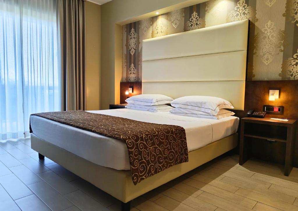 Giường trong phòng chung tại Hotel Pineta Palace