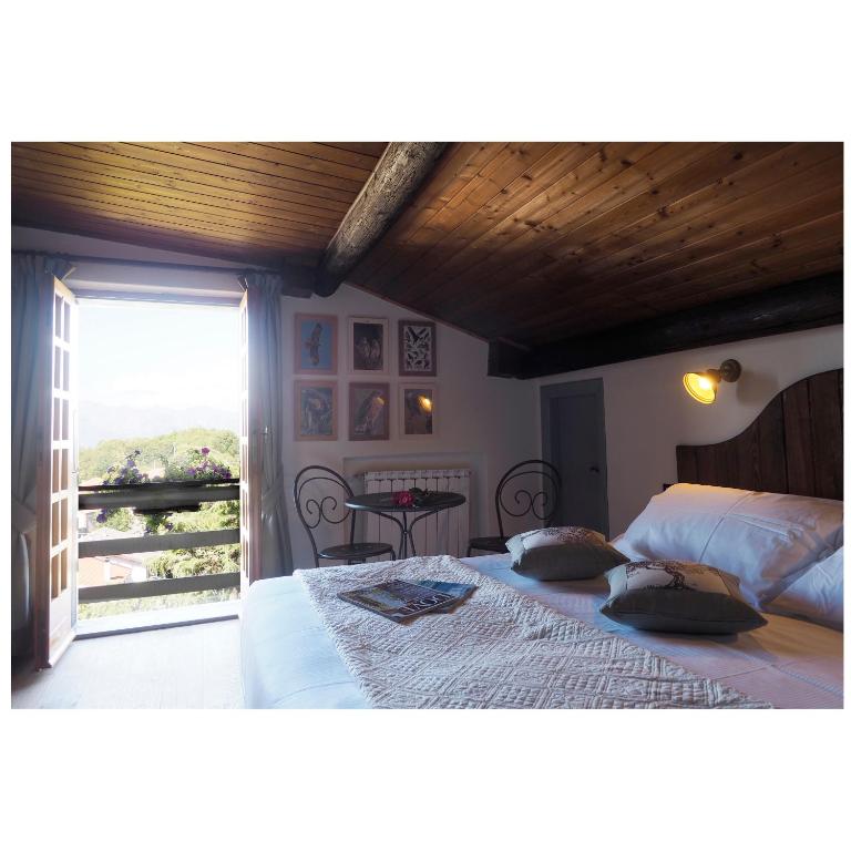Postel nebo postele na pokoji v ubytování Locanda Il Rustichello