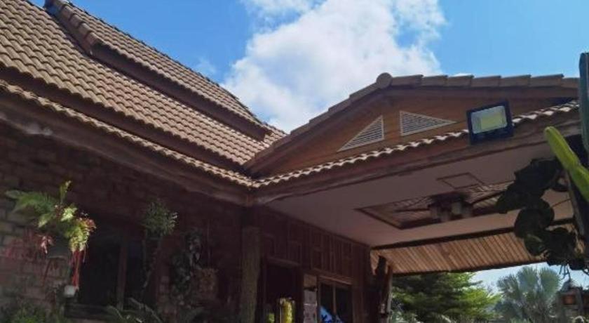 a house with a roof with a tv on it at Wangnamkhao Resort in Ban Huai Sai Khao