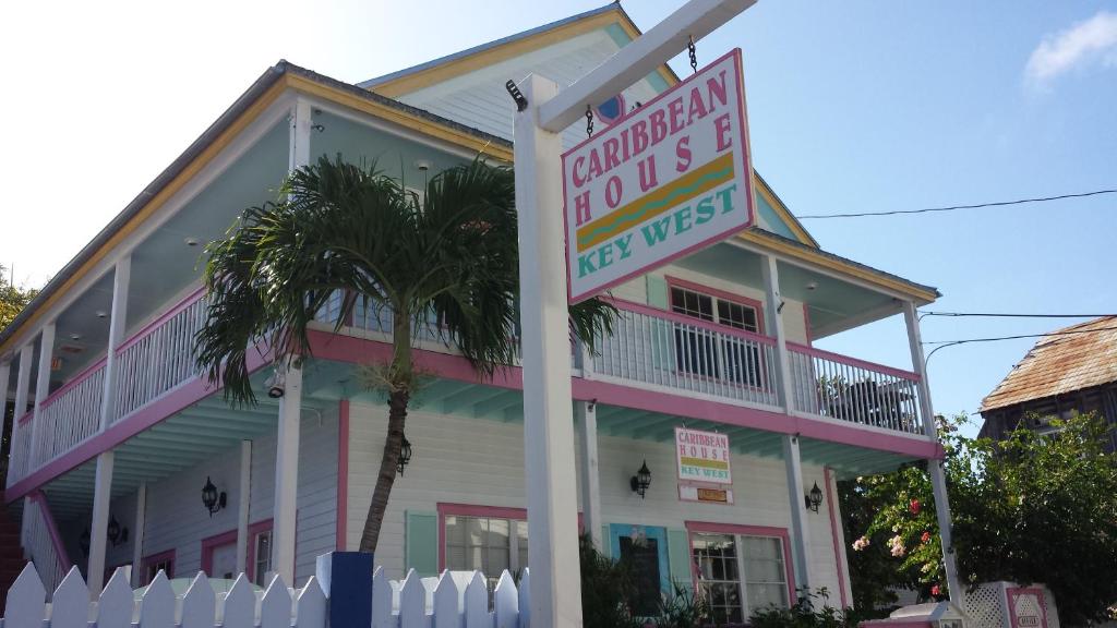 a building with a sign in front of it at Caribbean House, No Resort Fees in Key West