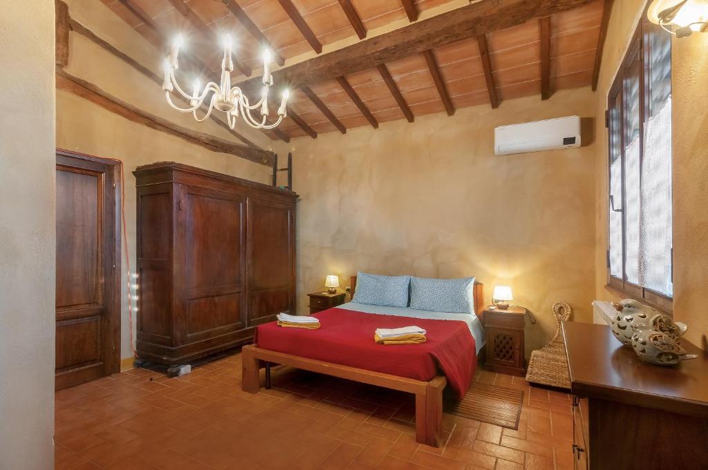 Postel nebo postele na pokoji v ubytování Borghetto Flat con piscina