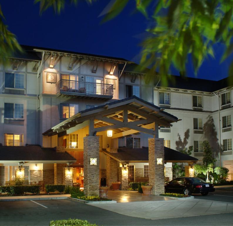 a rendering of the front of a hotel at night at Larkspur Landing Roseville-An All-Suite Hotel in Roseville