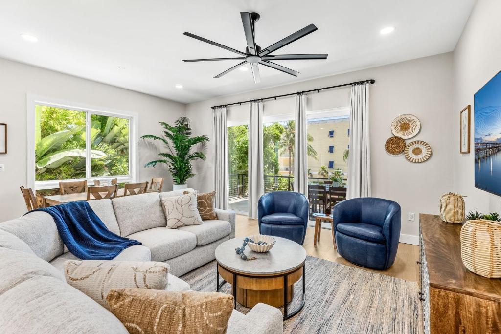 a living room with a couch and a table and chairs at 30 8th Avenue in Indialantic