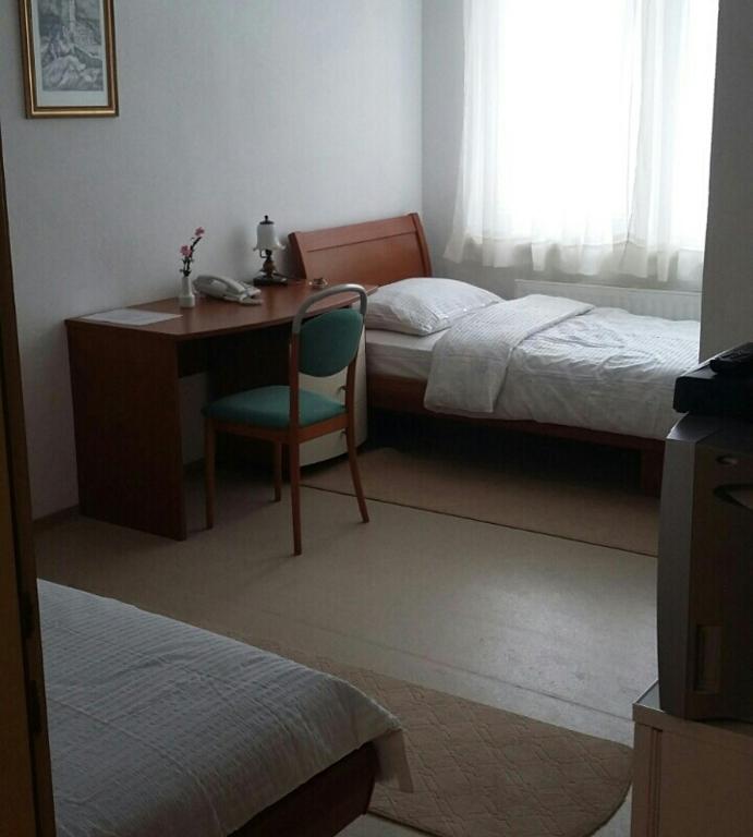 Postel nebo postele na pokoji v ubytování Motel and Restaurant Odušak