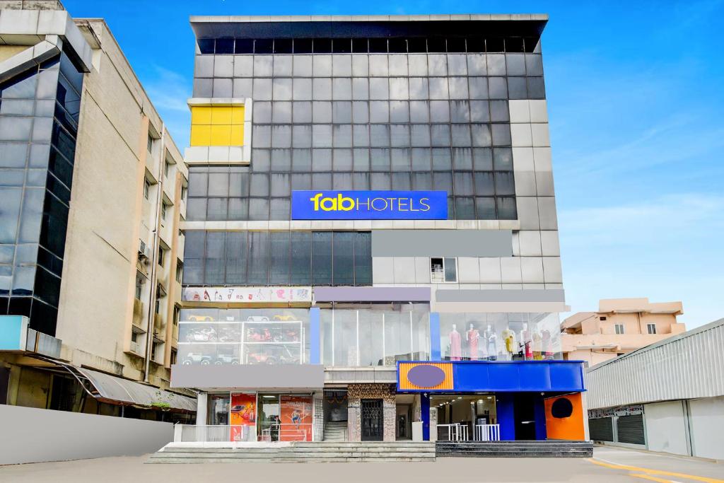 a building with a sign on the side of it at FabHotel Lorwen in Hyderabad