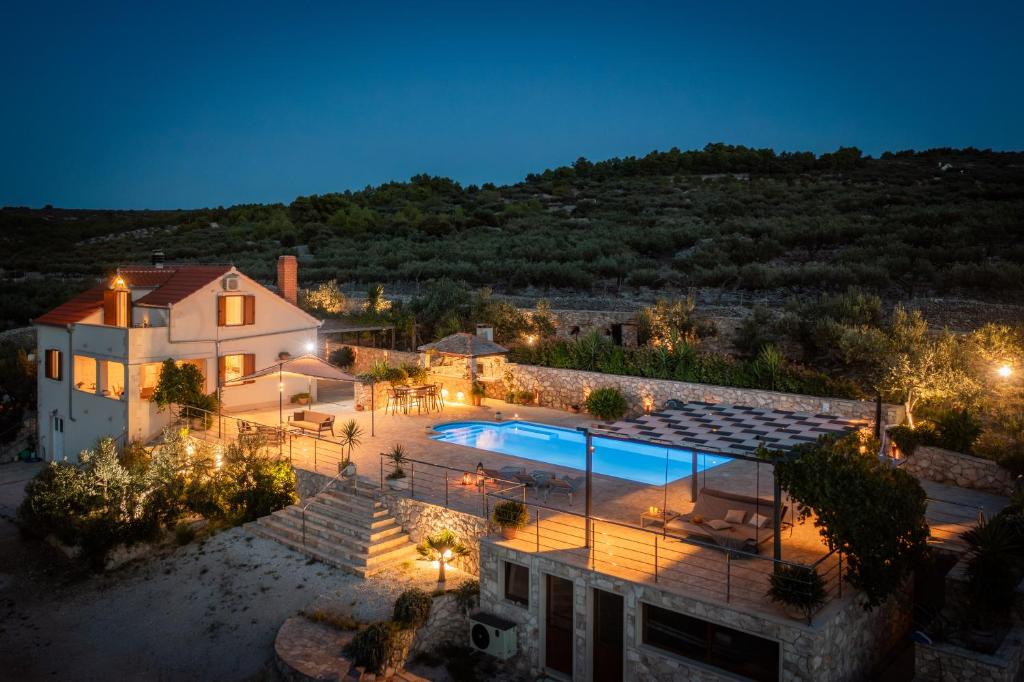 an aerial view of a house with a swimming pool at Villa Fani in Supetar
