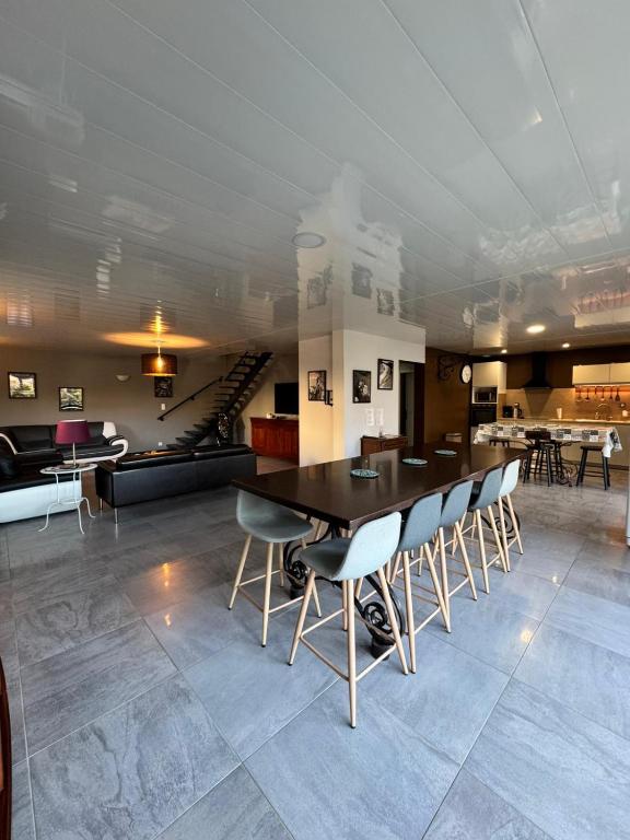 a dining room with a table and chairs at Coeur d'Argonne in Dombasle-en-Argonne