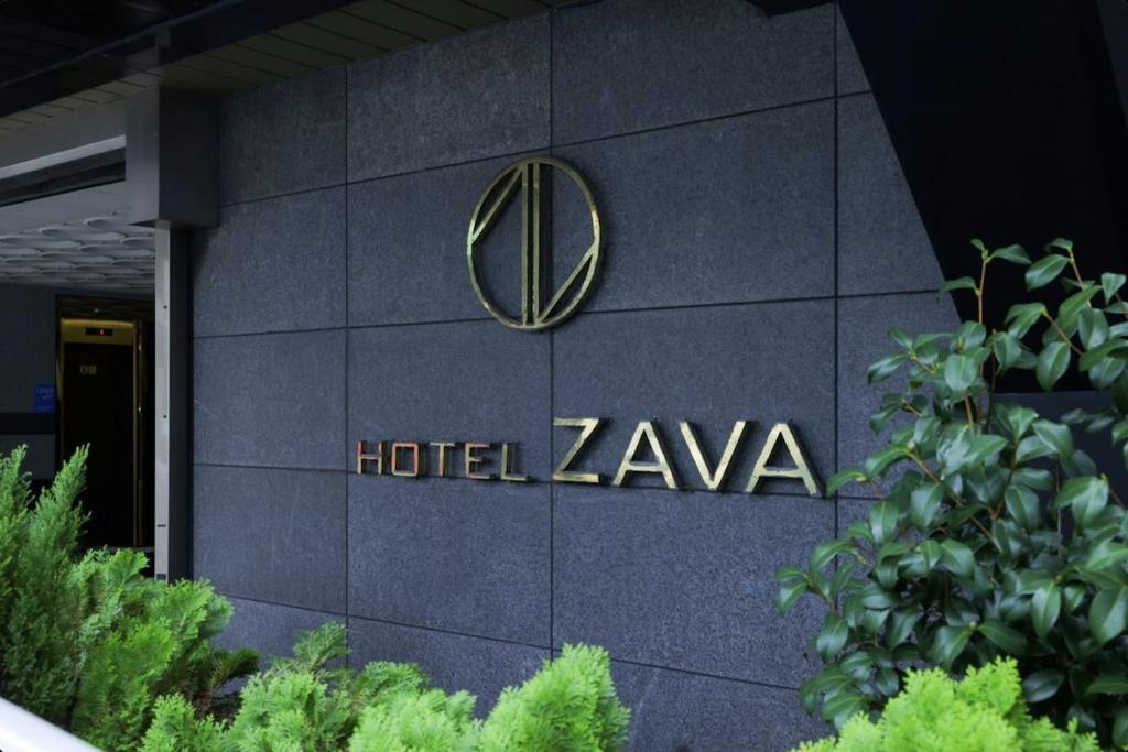 Et logo, certifikat, skilt eller en pris der bliver vist frem på Yeosu Hotel Zava