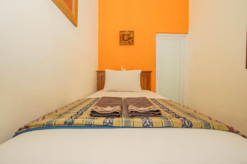 Ένα ή περισσότερα κρεβάτια σε δωμάτιο στο The Cabin Hotel Ambasador