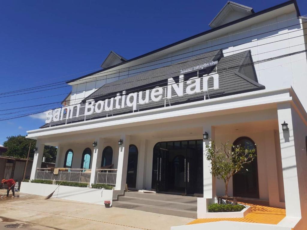 a building with a sign that reads san nourishmentinian at Sann Boutique Nan in Nan