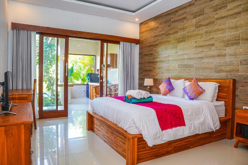 Ένα ή περισσότερα κρεβάτια σε δωμάτιο στο Nia cahya ubud villa