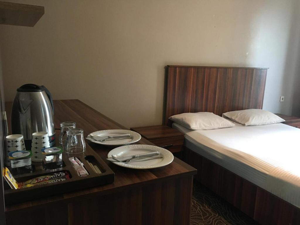 Ένα ή περισσότερα κρεβάτια σε δωμάτιο στο Ser Suite Apart Hotel