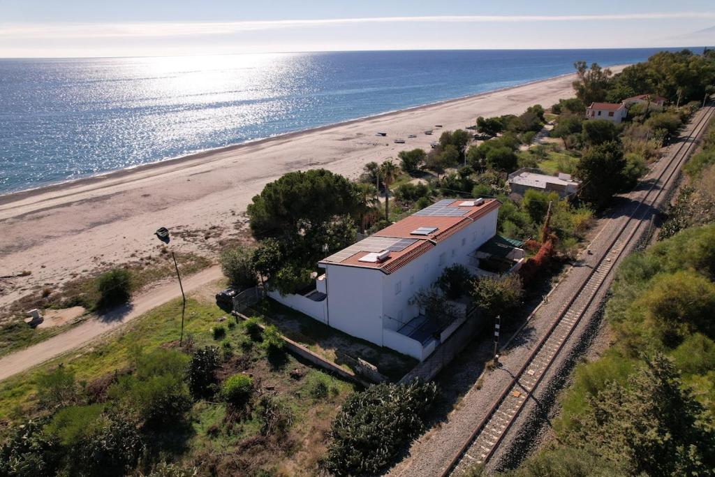 an aerial view of a house next to the beach at Max in Condofuri