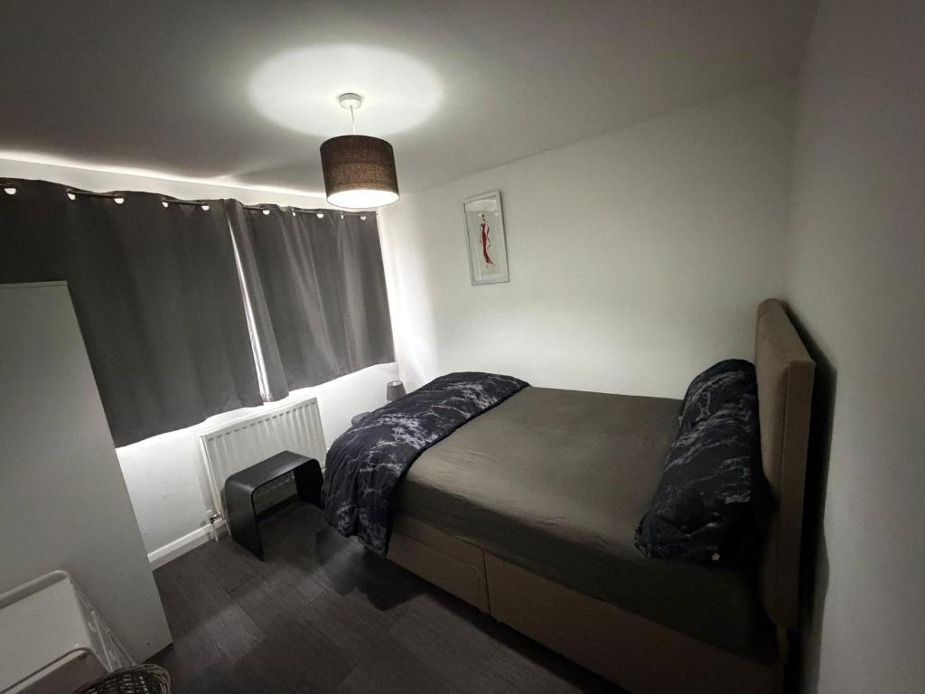 Ένα ή περισσότερα κρεβάτια σε δωμάτιο στο Private Room in Berkhamsted high street