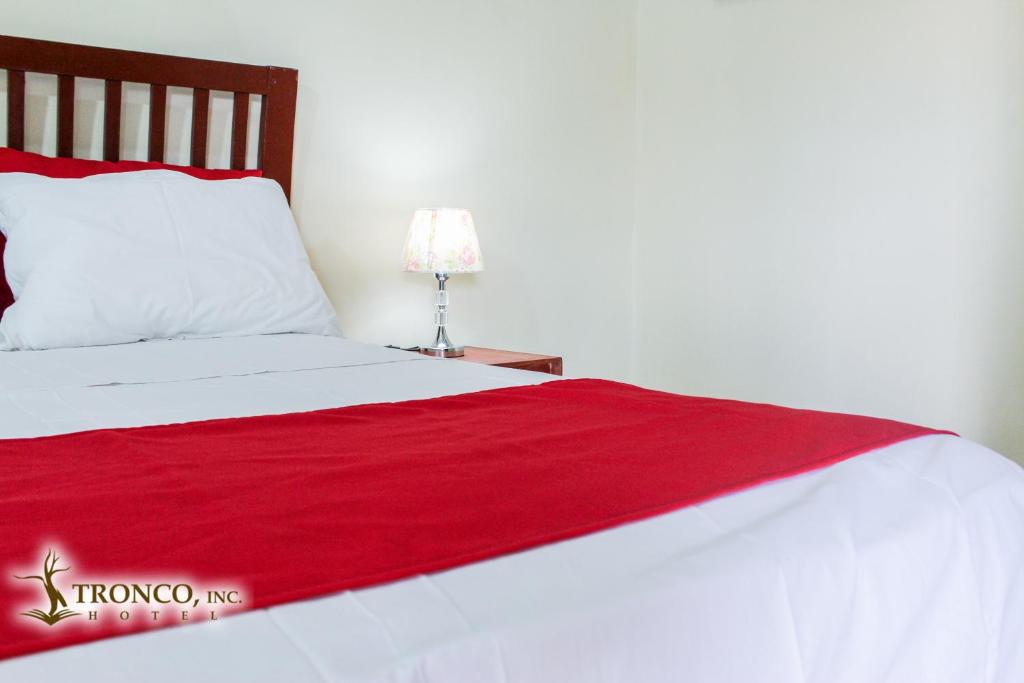 Postel nebo postele na pokoji v ubytování Hotel El Tronco Inc