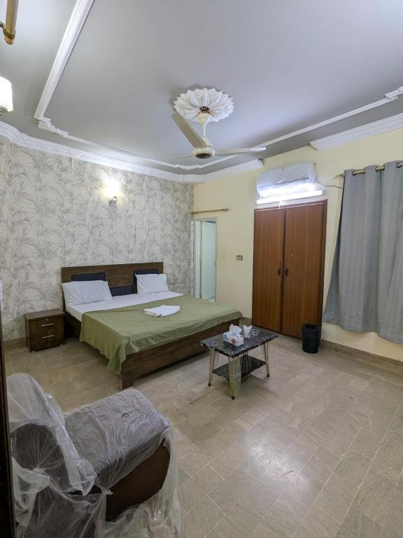 Кровать или кровати в номере Family Inn Guest House