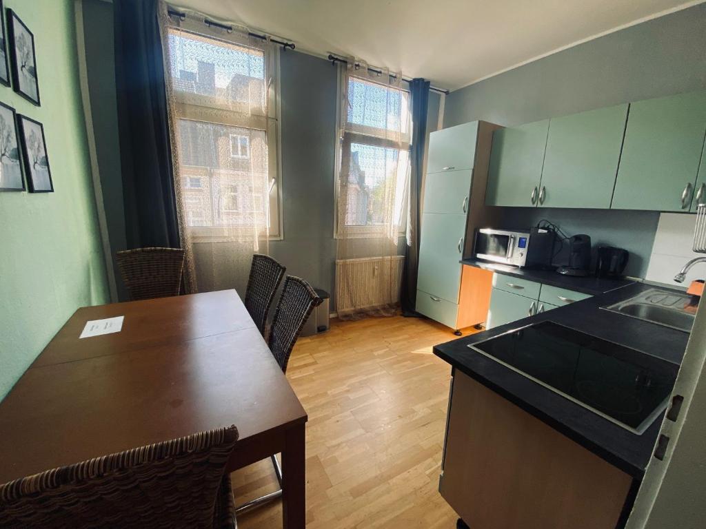 Kuchyň nebo kuchyňský kout v ubytování Gemütliche Zimmer - Messe Gruga