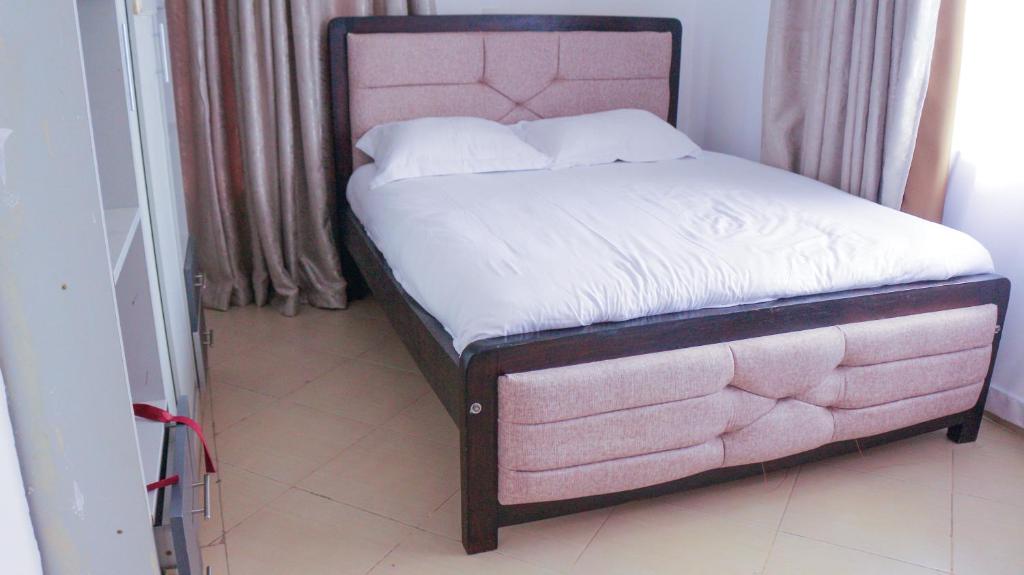 Ένα ή περισσότερα κρεβάτια σε δωμάτιο στο Lynn's homes